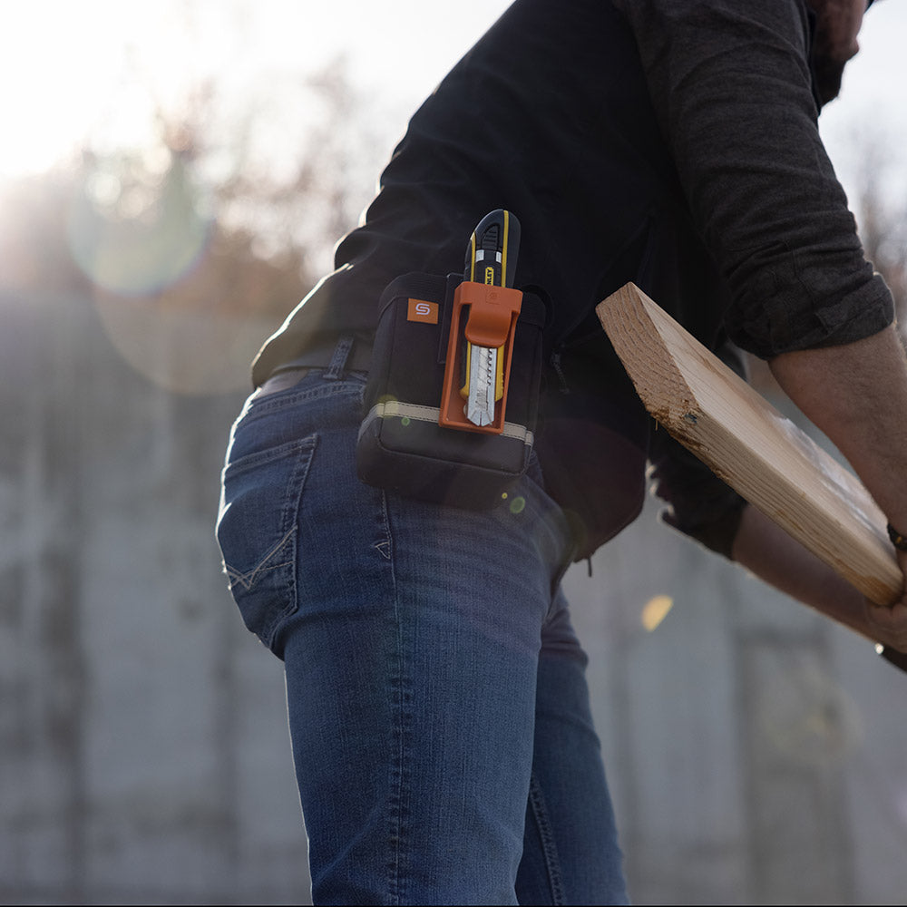 Drop Pouch using its tool storage for utility knives and other tools.