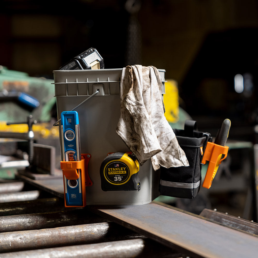 SwatClips Wall Mount attached to tool buckets for extra storage