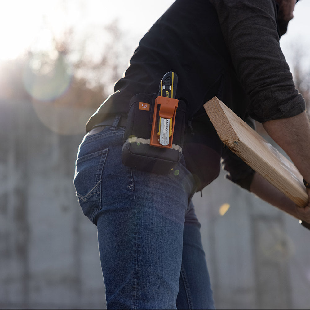 Utility knife held in Utility knife holster.